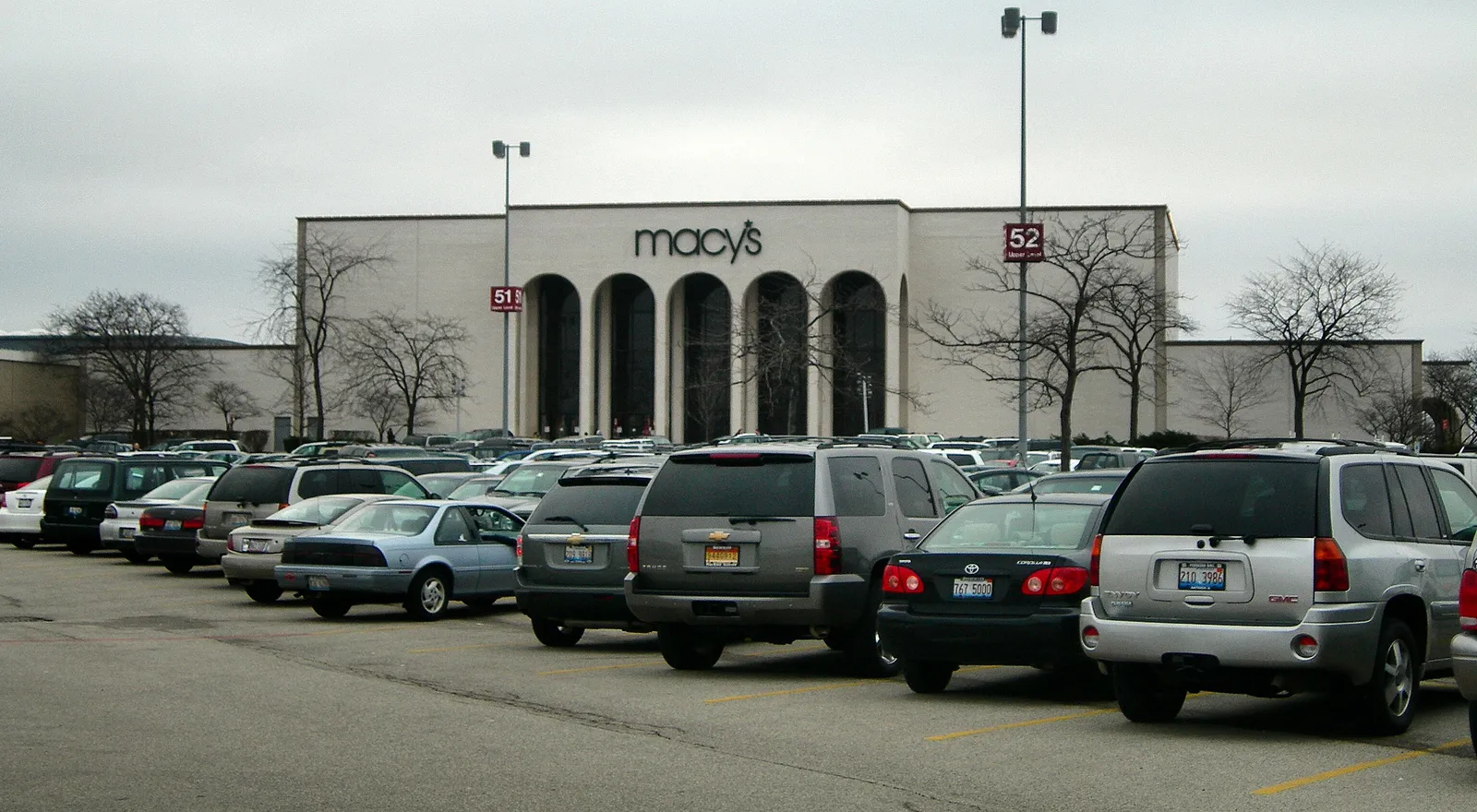 Macy’s entrance with tall arches and parked cars at Hawthorn Mall in a 2010 photograph